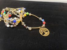 Cargar imagen en el visor de la galería, Multi colored Turkish eyes with crystals and hanging pendants