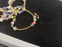 Cargar imagen en el visor de la galería, Multi colored Turkish eyes with crystals and hanging pendants