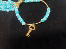 Cargar imagen en el visor de la galería, Aqua blue crystal and pearls bangle with hanging pendants