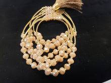 Load image into Gallery viewer, Cream colored crystal Bangle with ornament and hanging heart shaped pendant