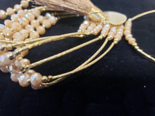 Load image into Gallery viewer, Cream colored crystal Bangle with ornament and hanging heart shaped pendant