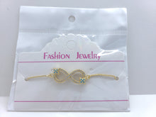 Cargar imagen en el visor de la galería, Infinity sign with clear crystals and blue crystal stars (bracelet)