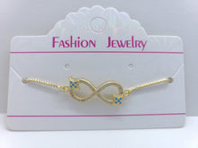 Cargar imagen en el visor de la galería, Infinity sign with clear crystals and blue crystal stars (bracelet)