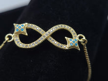 Cargar imagen en el visor de la galería, Infinity sign with clear crystals and blue crystal stars (bracelet)