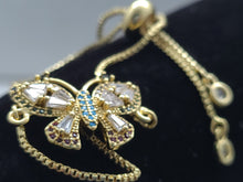 Cargar imagen en el visor de la galería, Hollow tipped Butterfly with blue and clear crystals (bracelet)