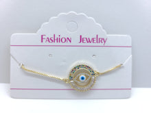 Cargar imagen en el visor de la galería, Hollow circle with multi color crystals and blue Turkish Evil Eye (bracelet)