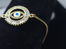 Cargar imagen en el visor de la galería, Hollow circle with multi color crystals and blue Turkish Evil Eye (bracelet)
