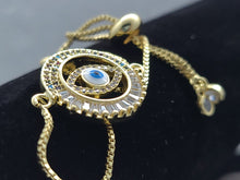 Cargar imagen en el visor de la galería, Hollow circle with multi color crystals and blue Turkish Evil Eye (bracelet)