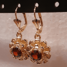 Load image into Gallery viewer, Small laminated flowers with red centered crystals