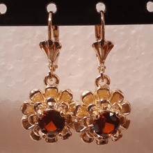 Load image into Gallery viewer, Small laminated flowers with red centered crystals