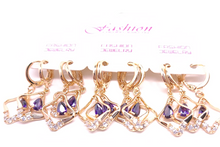 Cargar imagen en el visor de la galería, Hollow diamond shaped with hanging purple crystal