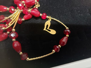 Dark red circle and diamond shaped crystal bangle with hanging pendant