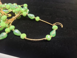 Green circle and diamond shaped crystal bangle with hanging pendants