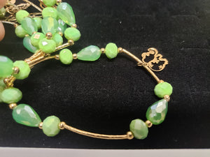 Green circle and diamond shaped crystal bangle with hanging pendants