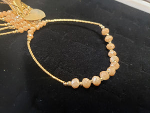 Cream colored crystal Bangle with ornament and hanging heart shaped pendant