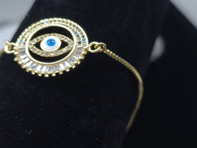 Cargar imagen en el visor de la galería, Hollow circle with multi color crystals and blue Turkish Evil Eye (bracelet)
