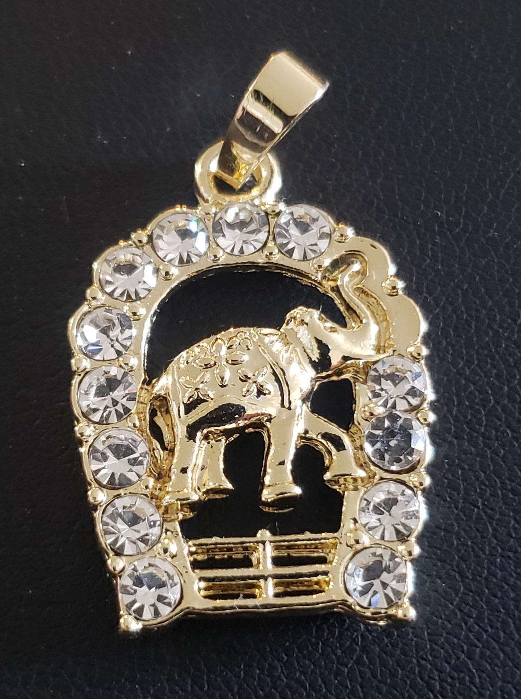 Elephant on stable in hollow upside down horseshoe
