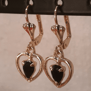 Small hanging hollow hearts with a black crystal center