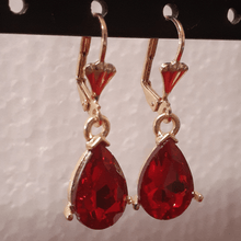 Load image into Gallery viewer, Small hanging red oval crystal
