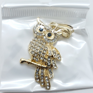 Laminated owl on branch with clear crystals