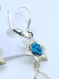 Small light blue rose with a swinging blue crystal rose