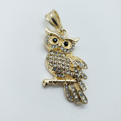 Laminated owl on branch with clear crystals