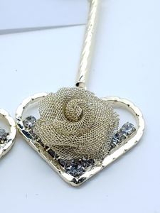 Hanging gold mesh rose in hollow heart with clear crystals