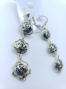 Hollow roses outlines with black crystals