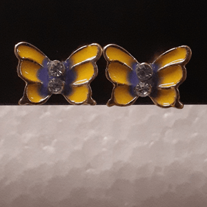 Small yellow butterflies with a blue center and crystals